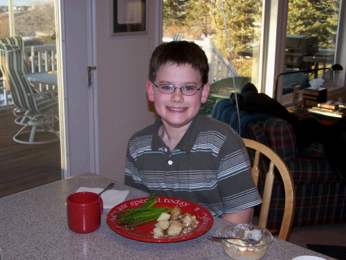 Clark enjoying Loren's famous (made by Dad) roasted potatoes.