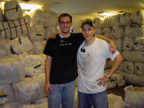 Elder Brown and Elder Shelton -- sweaty from unloading the truck filled with clothing to be distributed.