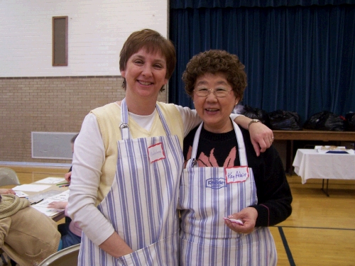 One of the ladies on my committee -- we had matching aprons donated by the owner of Rhodes Rolls who lives in our neighborhood.  People were so generous!