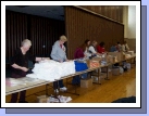 Ladies helping to assemble several hundred women's hygiene kits.