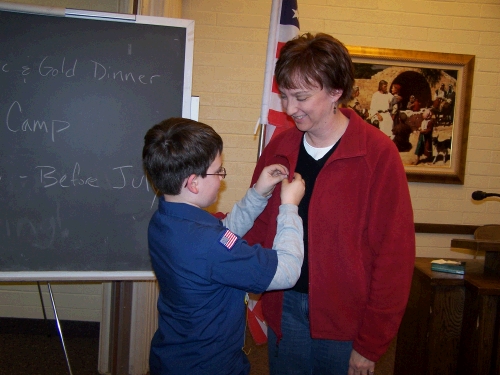 Clark pinning the bear pin on my fleece.  Maybe I should get one of those mother's thingies to put all the pins on?