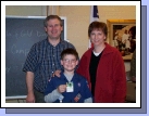 The proud Cub Scout with his parents and his new "Bear" badge.