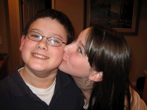 A birthday kiss from his sister Madeleine.