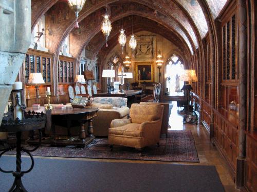 This is William Randoph Hearst's private library filled with hundreds of books -- many of them first editions.  That is a portrait of him on the wall at the back of the room.