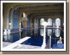 The indoor pool was 10 feet deep and beautifully reflected all the magnificent tile work on the walls and ceilings.  The part jutting out half way down the left side of the room is a diving platform.