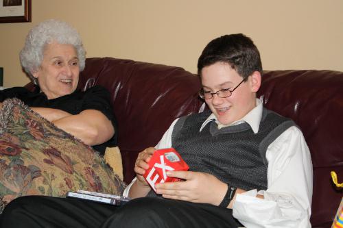 Clark is opening a new watch from his Grandparents.