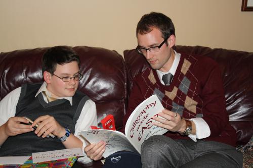 Phillip gave him a "how to" book about calligraphy along with a notebook and cool pens.