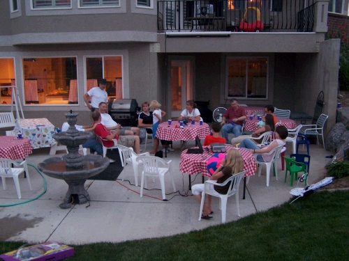 Enjoying a barbeque dinner on Melanie's back patio.