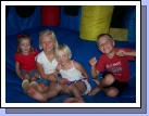 Karen Crapo, Marielle and Miranda Hulme and Justin Morgan -- Cousins having fun in the inflatable castle!