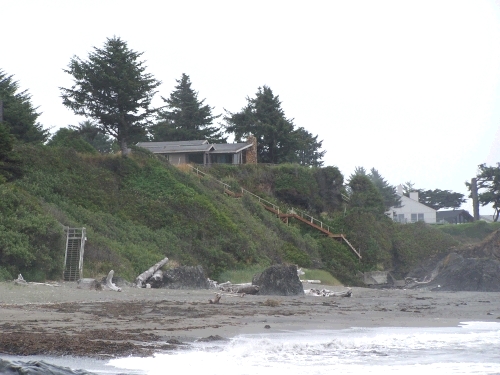 This is looking up at our house from down on the beach.  Our stairs are actually around on the other side of the rocks.