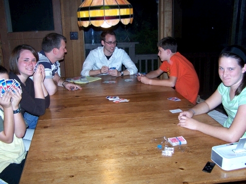 The family enjoying a game of Phase 10.  Is Madeleine making a face because I am taking her picture or is she losing the game?