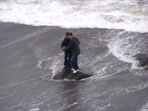 Quick!  Get off the rock before the next wave hits!