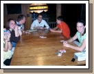 The family enjoying a game of Phase 10.  Is Madeleine making a face because I am taking her picture or is she losing the game?