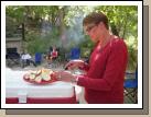 Melinda cutting up potatoes for their foil dinners.