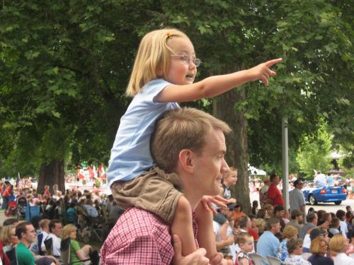 Anna happy to watch the parade from her Dad's shoulders.