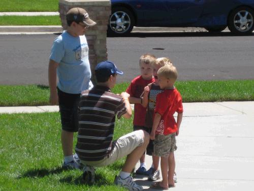 Clark and Elliot teaching the Hooligans how to play football.