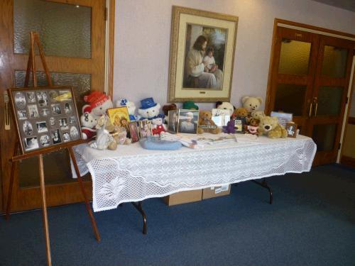 We set up a display table to show off some of Shirley's many teddy bears, her sewing and some favorite photos.