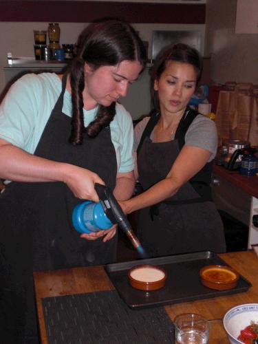 The first class they took was a pastry class.  This is their instructor Rachel showing Anne how to glaze Crme Brle.