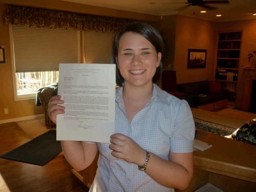 Tess holding up her mission call.  We forgot to do that the day she opened it.  "Better late than never," I always say.