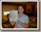 Tess holding up her mission call.  We forgot to do that the day she opened it.  "Better late than never," I always say.