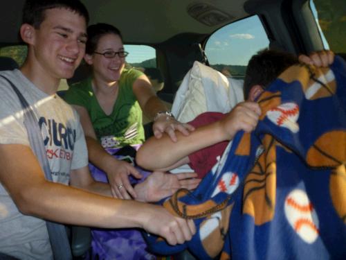 One the way to Oregon!  Madeleine and Elliot having a little fun teasing Clark who for some reason was resisting having his picture taken!