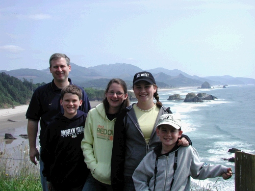 The family at Ecola State Park with Haystack Rock in the Background.