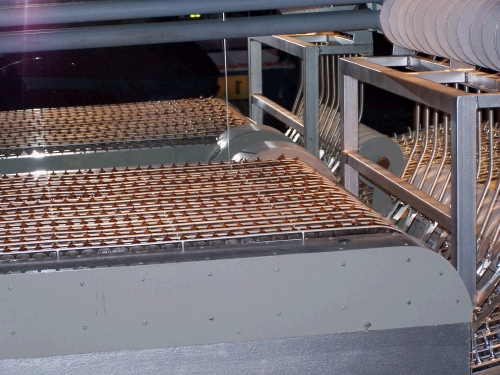 We learned all about the process of making chocolate.  This picture shows rows and rows of chocolate kisses.  