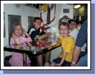 Here are the kids down below in the submarine's mess hall.  It was amazing to us that so many men could eat and sleep in such cramped quarters.