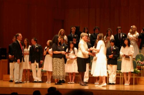 Nancy Heuston awards the diplomas.  It was difficult to get good photos because of the distance and the lighting...oh well...