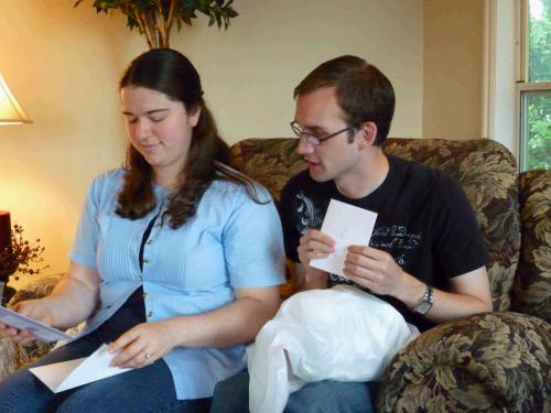 Anne and Loren opening gifts at the neighborhood shower.