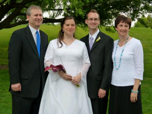 The one happy couple with the other happy couple.