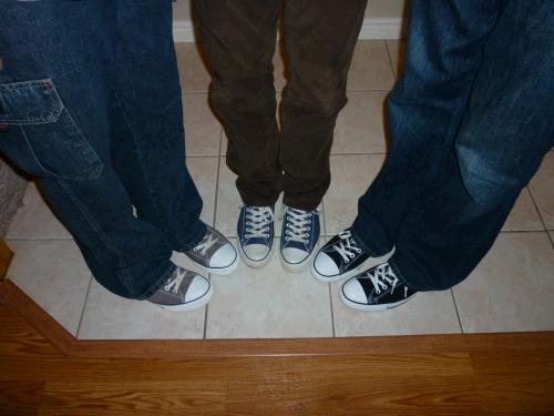 Three of my sons with matching shoes...