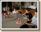 The party guests having a "power snack" before the big game.