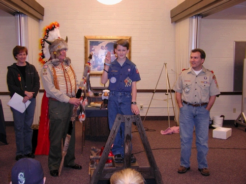 Before he could cross the bridge to the Boy Scout leader, he had to spout off a few scout things - oaths etc.  He did great!