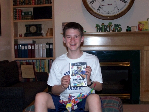 His first game cube game -- a little behind everyone else, but since I don't believe in them, he is very excited to have finally worn me down and to be the proud owner of one.