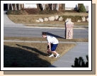 In the basketball and football shirt playing baseball...