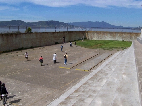 The recreation yard looking out from the building.  Alan is the little guy in a yellow shirt with a black backpack.