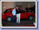 Me with our niece Jessica and her cute little red car.