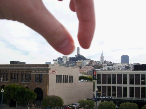 Elliot trying to pick up Coit Tower -- couldn't quite do it!