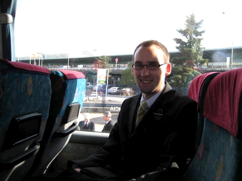 On the bus about to picked up by President Farnsworth (man on the right just outside the bus.)