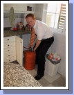 Elder Clark changing the "bombona" - how they get hot water.