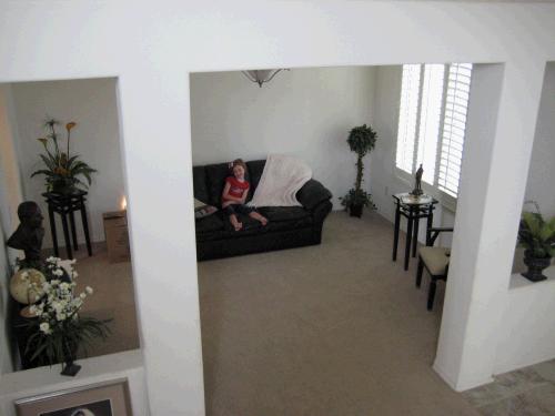 The Living room is to the right of the front door when you walk in.  This is taken from the stairs.