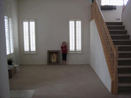 The piano room to the left of the front door - taken from the living room.  Won't their baby grand piano look great in there?