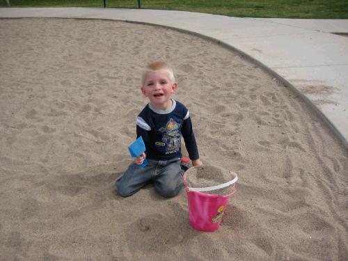 Jackson loves digging in the sand.