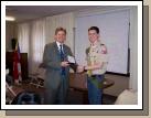 Bishop Valentine (former scoutmaster) awarding Elliot his Eagle Scout award.