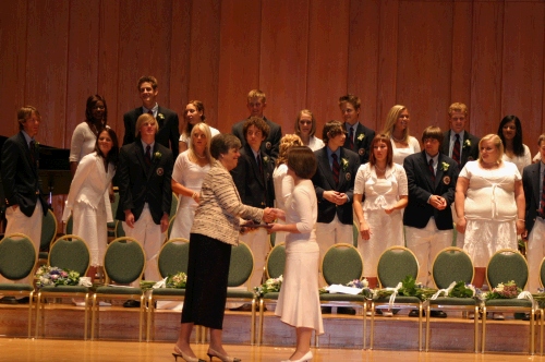 Tess receiving her diploma from the Head of School, Nancy Heuston.