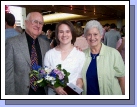 The graduate with the proud grandparents.