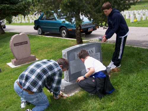 The birds always seem to like my parent's headstone -- gives the kids something to do while Alan attacks the grass.