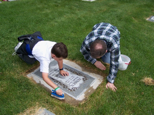 Alan and Clark working on Bob's headstone (Aunt Shirley's husband) who is also buried at the Salt Lake City Cemetery.