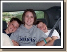 Tess just loves sitting in the back between her adorable little brothers -- yeah right.